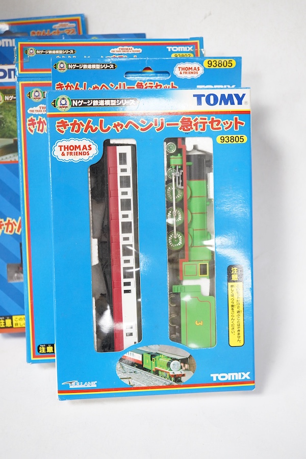 Four boxed Tomix (by Tomy) N gauge railway Thomas the Tank Engine & Friends train packs, comprising of three locomotives and rolling stock (one locomotive and a wagon missing): James (93802) - James and one wagon missing